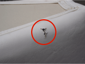 Ripped marine vinyl cushion - before