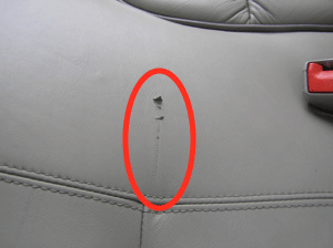 Scratched leather seat - before